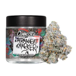 Jar of Connected brand ‘Permanent Marker’ cannabis flower with graffiti-style artwork on the label, shown next to a large frosty bud covered in orange hairs and crystal trichomes.
