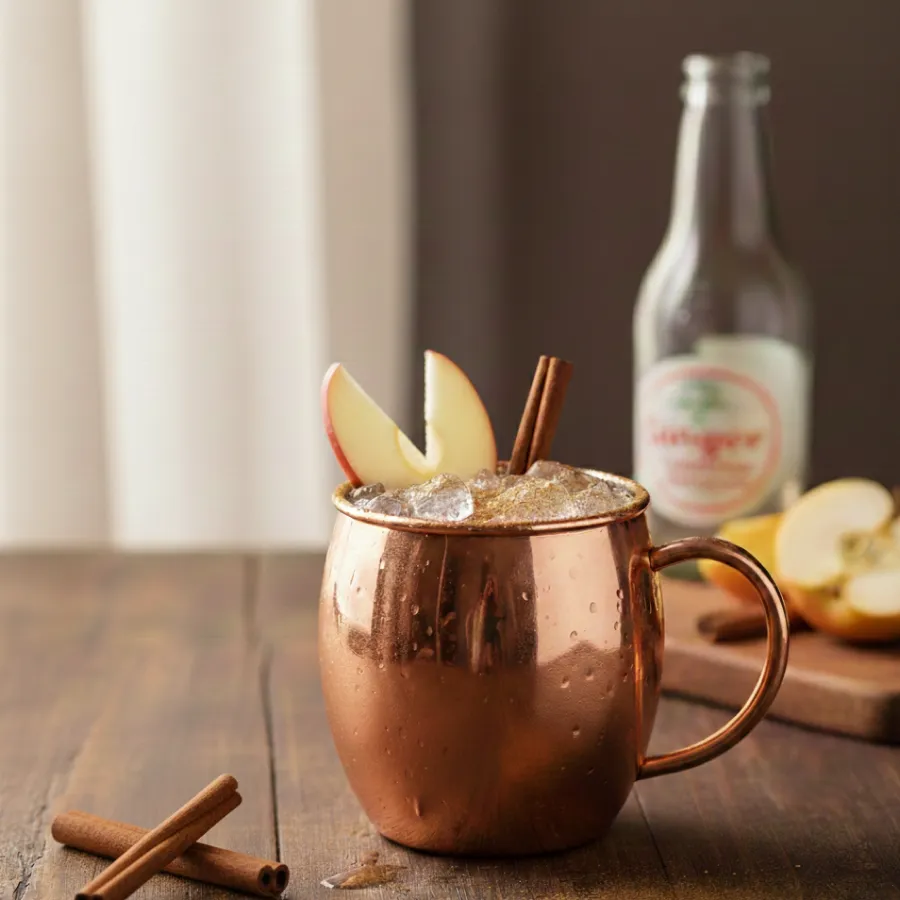 Copper mug with apple and cinnamon