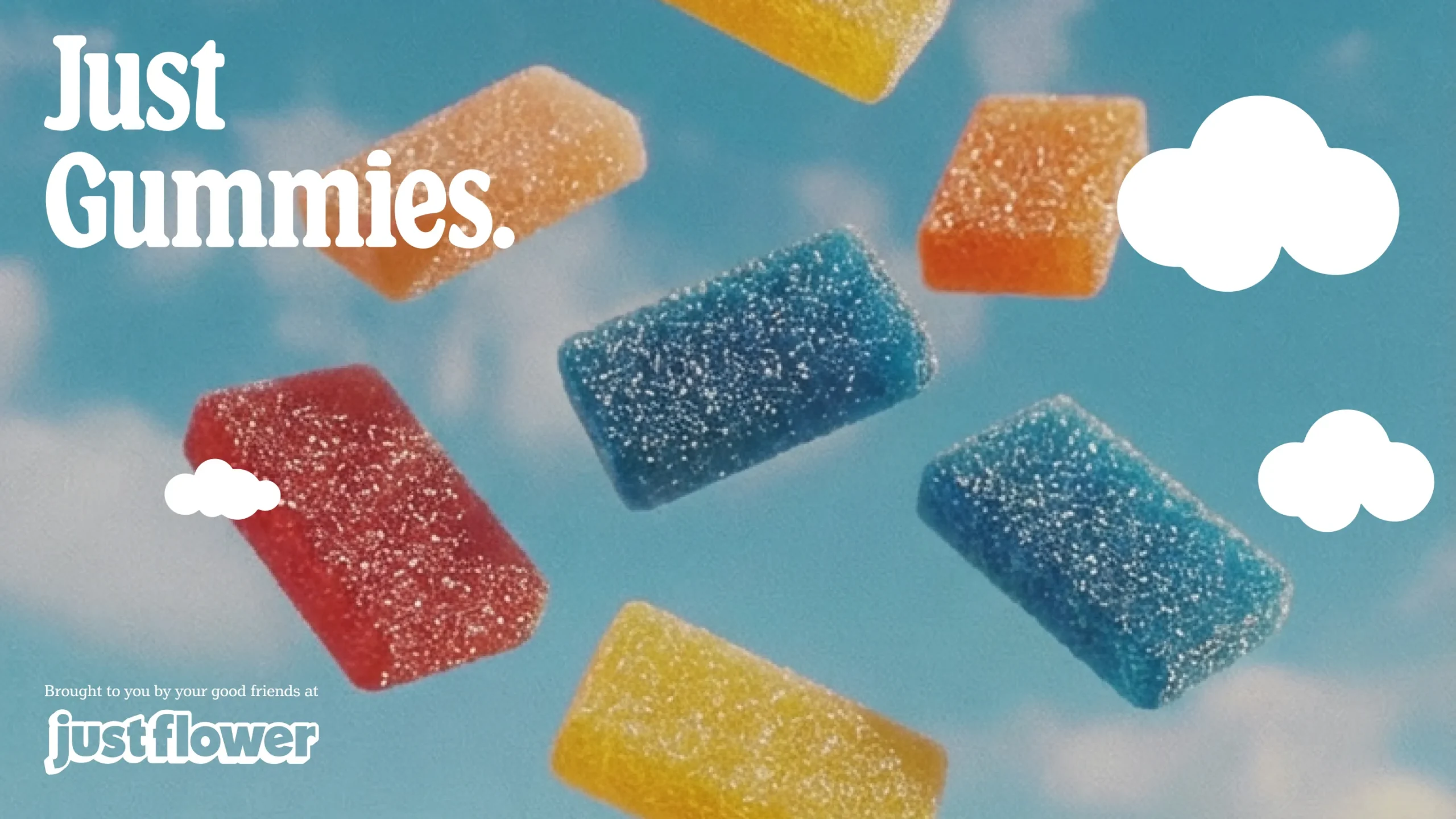 Colorful gummy candies against blue sky