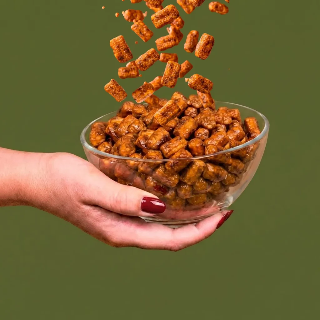 hand holding a bowl of fade co infused pretzels